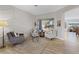 Bright living room with hardwood floors, decorative wall paneling, and comfortable seating at 2862 Sapphire Desert Dr, Henderson, NV 89052
