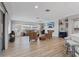 Inviting living room with open layout, fireplace, and seamless flow to kitchen at 2862 Sapphire Desert Dr, Henderson, NV 89052