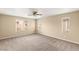 Bright bedroom with plush carpeting, neutral walls, and multiple windows at 3049 Historic Horizon Ave, Henderson, NV 89044