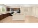 Bright kitchen boasts granite countertops, island with sink, and stainless steel appliances at 3049 Historic Horizon Ave, Henderson, NV 89044