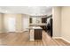 Open concept kitchen features granite countertops, island with sink, and ample cabinet space at 3049 Historic Horizon Ave, Henderson, NV 89044