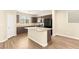 Spacious kitchen features granite countertops, island with sink, and modern appliances at 3049 Historic Horizon Ave, Henderson, NV 89044