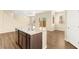 Kitchen island provides counter seating and a sink, opening to the living area and backyard at 3049 Historic Horizon Ave, Henderson, NV 89044