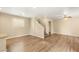 Spacious living room with staircase, wood flooring, and natural light beaming throughout at 3049 Historic Horizon Ave, Henderson, NV 89044