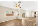 Spacious living area with wood floors, a ceiling fan, and lots of natural light at 3049 Historic Horizon Ave, Henderson, NV 89044