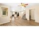 Bright, open-concept living room boasts wood floors, natural light, and a staircase at 3049 Historic Horizon Ave, Henderson, NV 89044