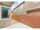 Backyard patio features a gravel area, privacy wall, and a window at 3049 Historic Horizon Ave, Henderson, NV 89044