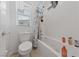 Bright bathroom features a bathtub with a showerhead and white subway tile surround, offering a clean look at 31 Strada Loreto, Henderson, NV 89011