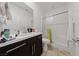 Modern bathroom features a shower with a glass door and vanity with sink and chrome faucet at 31 Strada Loreto, Henderson, NV 89011