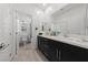 Bathroom features a double vanity with a large mirror and a separate toilet room for added privacy at 31 Strada Loreto, Henderson, NV 89011