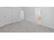 Spacious bedroom with carpet, closet with sliding doors, and doorway leading to the ensuite bathroom at 31 Strada Loreto, Henderson, NV 89011