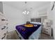 Comfortable bedroom with neutral tones, a chandelier, and matching bedside tables at 31 Strada Loreto, Henderson, NV 89011