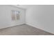 Clean bedroom featuring neutral carpet, bright light, and white walls create a calming and comfortable space at 31 Strada Loreto, Henderson, NV 89011