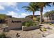 Beautiful Armano community entrance with lush landscaping and desert plants surrounding the signage at 31 Strada Loreto, Henderson, NV 89011
