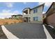 Modern home showcases gravel landscaping, an open second-story balcony, and stone accents at 31 Strada Loreto, Henderson, NV 89011