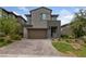 Charming two-story home with a two-car garage, stone accents, and desert landscaping at 31 Strada Loreto, Henderson, NV 89011