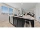 Modern kitchen island features a stainless steel dishwasher, sink, and a bright window with scenic views at 31 Strada Loreto, Henderson, NV 89011