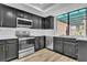 Well-lit kitchen featuring stainless steel appliances and modern finishes at 3140 Pradera Cir, Las Vegas, NV 89121