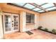 Inviting patio with tiled floor, a lattice overhead and seamless indoor-outdoor living at 3140 Pradera Cir, Las Vegas, NV 89121