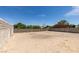 Large backyard ready for landscaping and entertainment under the bright blue sky at 3330 Rio Grande St, Las Vegas, NV 89115