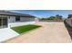 The backyard is ready for landscaping, with an artificial grass patch at 3330 Rio Grande St, Las Vegas, NV 89115