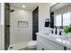 Updated bathroom featuring a tiled walk-in shower, modern fixtures, and a sleek vanity for a spa-like experience at 3330 Rio Grande St, Las Vegas, NV 89115