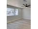 Bedroom with new hardwood floors, ceiling fan and window with security bars at 3330 Rio Grande St, Las Vegas, NV 89115