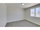 Bedroom with neutral carpet, a window for natural light, and freshly painted walls at 3330 Rio Grande St, Las Vegas, NV 89115