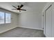 Bright bedroom features a ceiling fan and ample natural light through a window with stylish security bars at 3330 Rio Grande St, Las Vegas, NV 89115