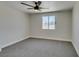 Bright bedroom features a ceiling fan and ample natural light through a window with stylish security bars at 3330 Rio Grande St, Las Vegas, NV 89115