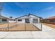 Charming single-story home with well-kept landscaping, featuring a fenced yard and a driveway leading to the garage at 3330 Rio Grande St, Las Vegas, NV 89115