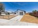 Well maintained single-story home with modern design featuring a chain-link fenced yard and a driveway leading to the garage at 3330 Rio Grande St, Las Vegas, NV 89115