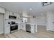 Bright kitchen features white cabinets, stainless steel appliances, and a functional island for meal preparation at 3330 Rio Grande St, Las Vegas, NV 89115