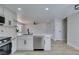 Bright kitchen features white cabinets, stainless steel appliances, and a functional island for meal preparation at 3330 Rio Grande St, Las Vegas, NV 89115