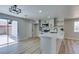 Modern kitchen with white cabinets, stainless appliances, and backyard access at 3330 Rio Grande St, Las Vegas, NV 89115