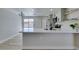 Modern kitchen features white countertops, stainless steel appliances, and an open design that is great for entertaining at 3330 Rio Grande St, Las Vegas, NV 89115