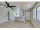 Open-concept living room featuring a modern ceiling fan and natural light at 3330 Rio Grande St, Las Vegas, NV 89115