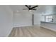 Bright, open living room featuring wood-look flooring and modern ceiling fan at 3330 Rio Grande St, Las Vegas, NV 89115
