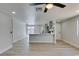 Spacious living room features wood flooring, a kitchen island, and sliding glass doors to access the backyard at 3330 Rio Grande St, Las Vegas, NV 89115