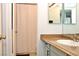 Bathroom featuring a modern sink, vanity, mirror, and toilet with shower curtain at 3740 Desert Marina Dr # 11, Laughlin, NV 89029