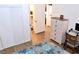 Bedroom featuring light wood flooring, desk, dresser, and bathroom access at 3740 Desert Marina Dr # 11, Laughlin, NV 89029