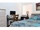 Bright bedroom featuring a work space with a desk and comfortable bed at 3740 Desert Marina Dr # 11, Laughlin, NV 89029