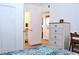 Bright bedroom featuring light wood floors and bathroom access at 3740 Desert Marina Dr # 11, Laughlin, NV 89029
