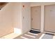 Neutral apartment entrance with dark door mat leading to door number 11 at 3740 Desert Marina Dr # 11, Laughlin, NV 89029