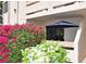 Cozy condo featuring a private patio with vibrant bougainvillea and a relaxing blue umbrella at 3740 Desert Marina Dr # 11, Laughlin, NV 89029