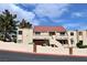 View of condo's exterior and stairs to the second level with a red tile roof at 3740 Desert Marina Dr # 11, Laughlin, NV 89029