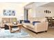 Bright living area with tan sofas, wood-look floors, and an open floor plan at 3740 Desert Marina Dr # 11, Laughlin, NV 89029