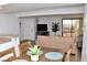A dining room and living room area with table set for four and sliding glass door at 3740 Desert Marina Dr # 11, Laughlin, NV 89029