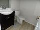 Bathroom showcasing a white sink basin, black vanity and toilet at 3890 Terrazzo Ave, Las Vegas, NV 89115