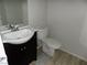 Bathroom featuring a white sink basin, black vanity and toilet at 3890 Terrazzo Ave, Las Vegas, NV 89115